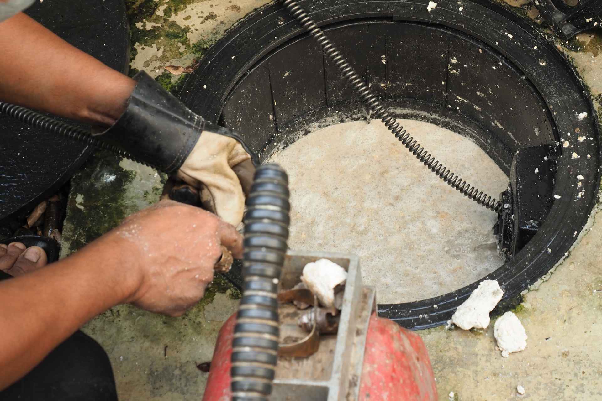 plumber cleaning sewer